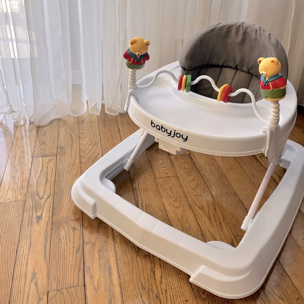 Baby Joy Walker with feeding tray and toys.